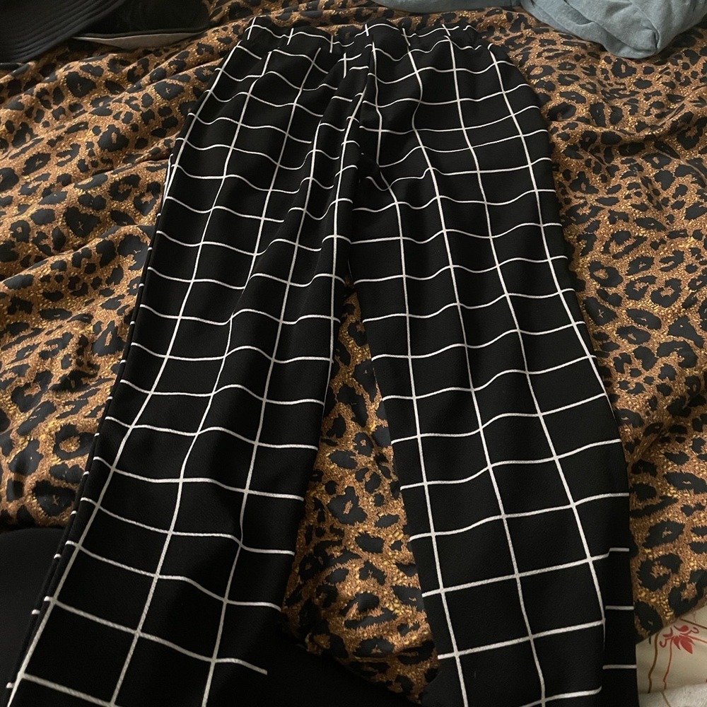 Black pants with white stripes